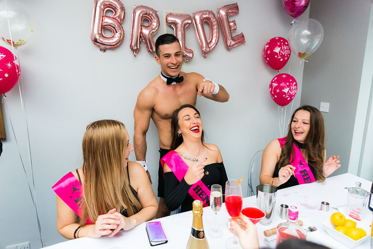 The bride squad in full laughter mode as the host turns up the charm